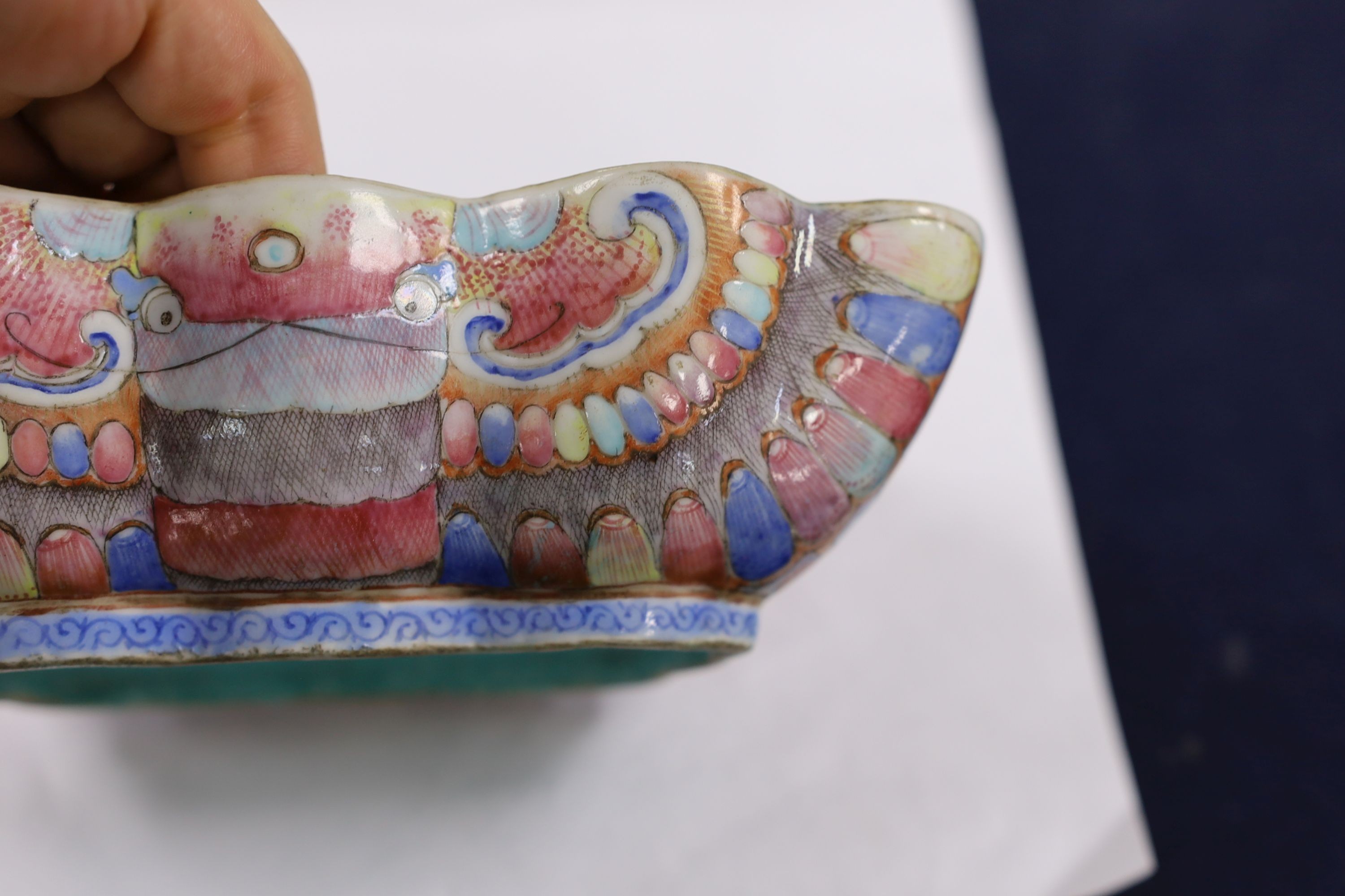 A Chinese enamelled porcelain ‘butterfly’ dish, 19th century, ground off reign mark, 19 cms wide at the front.